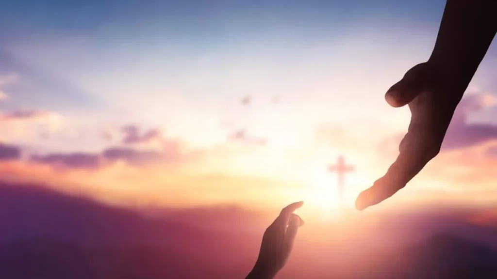 Imagem mao de deus e do homem se encontrando do artigo Virtudes teologais: fé, esperança e caridade