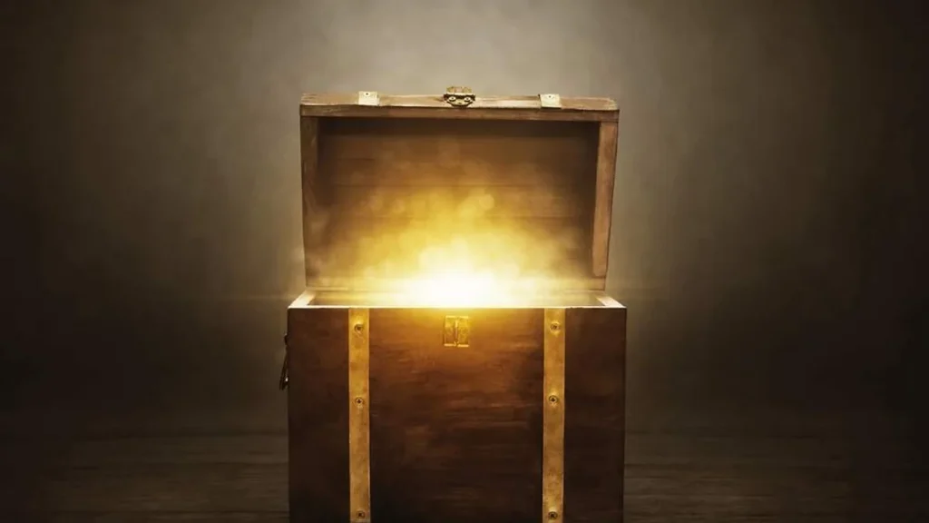 Imagem bau com uma luz saindo de dentro dele do artigo Qual é o verdadeiro tesouro da vida?