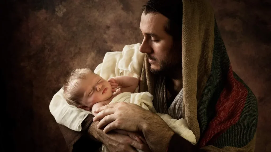 Imagem jose segura o menino jesus que adormece em seus bracos do artigo Por que São José é celebrado em duas datas diferentes?